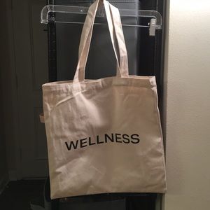 Canvas reusable tote bag that says wellness